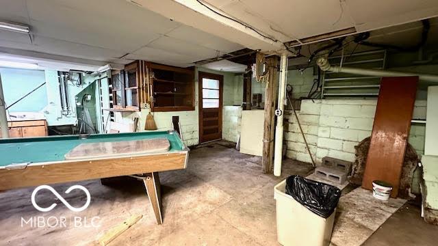 rec room with pool table and unfinished concrete floors
