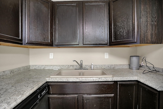 kitchen featuring light countertops, dark brown cabinetry, dishwasher, and a sink