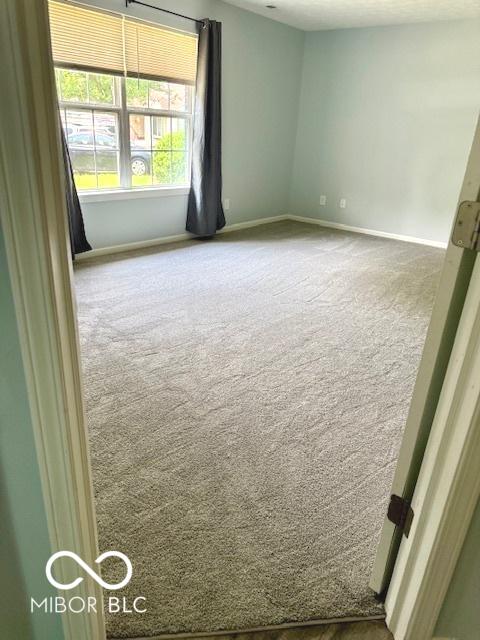 1102 Branifield Ct, Franklin, IN 46131 - carpeted empty room featuring baseboards