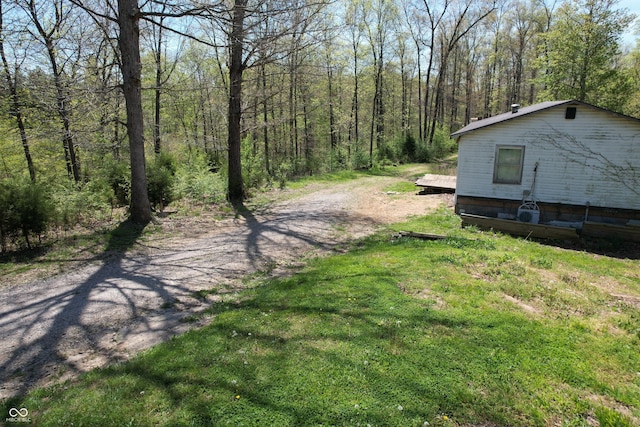 view of road with a wooded view