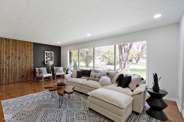 living room with recessed lighting, wood finished floors, and baseboards