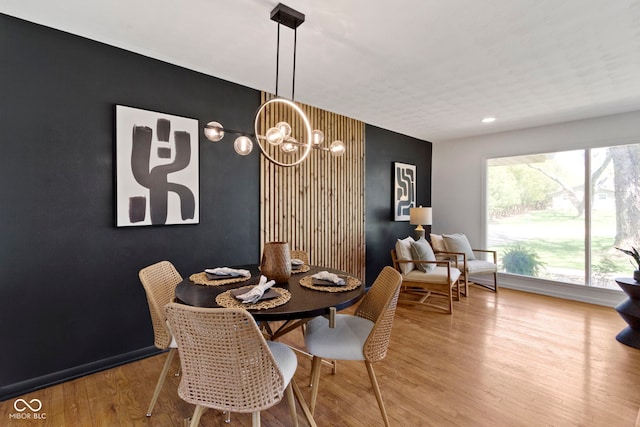 dining room featuring an inviting chandelier and wood finished floors
