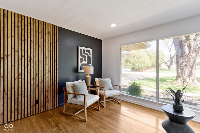 sitting room with recessed lighting and wood finished floors