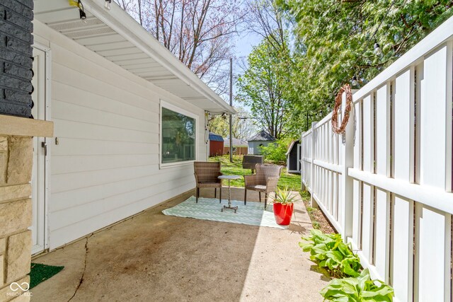 view of patio / terrace featuring fence
