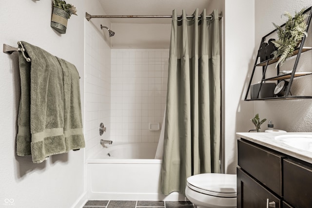 bathroom featuring toilet, shower / bath combo, and vanity