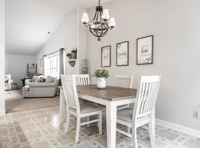 dining room featuring baseboards, high vaulted ceiling, and a notable chandelier