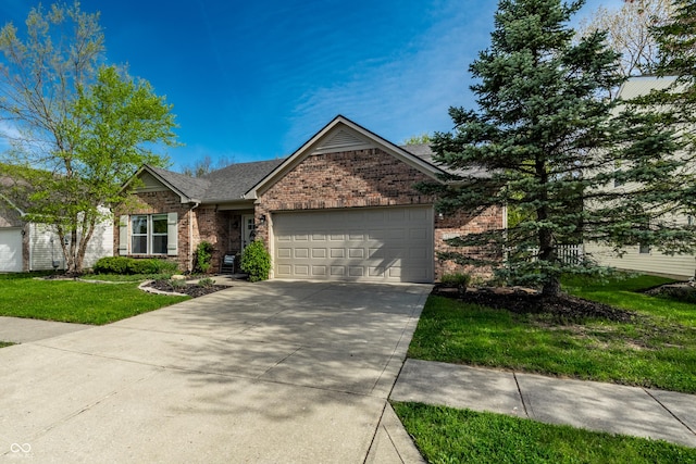 ranch-style home featuring a garage, a front yard, roof with shingles, brick siding, and concrete driveway