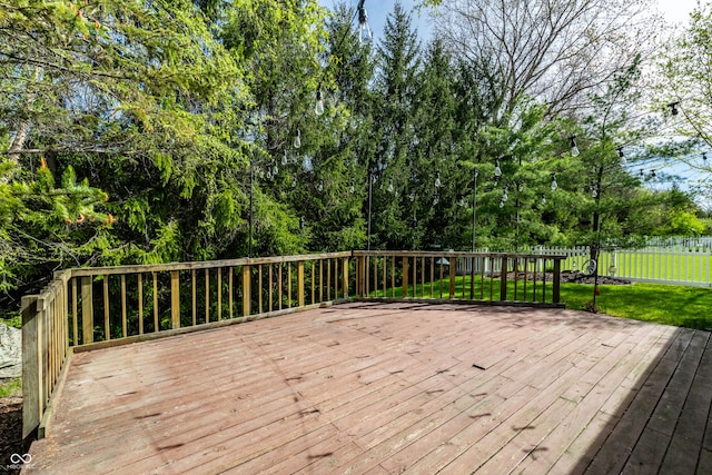 wooden deck featuring fence