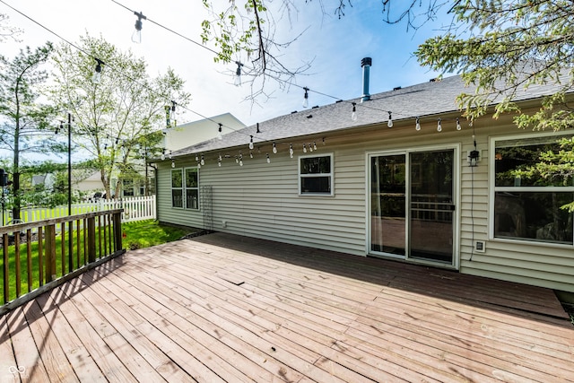 wooden terrace featuring fence