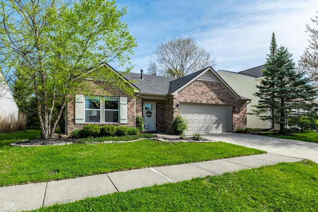 single story home featuring a shingled roof, an attached garage, a front lawn, brick siding, and concrete driveway