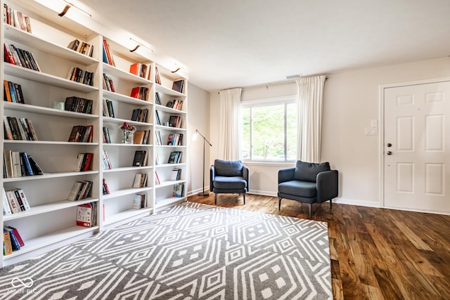 sitting room featuring wood finished floors and baseboards
