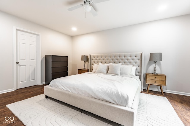 bedroom featuring wood finished floors, baseboards, and a ceiling fan