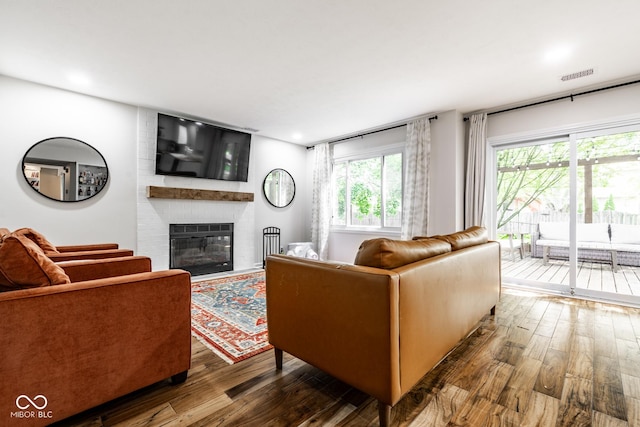 living area featuring hardwood / wood-style floors and a fireplace
