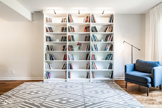 sitting room featuring wood finished floors and baseboards