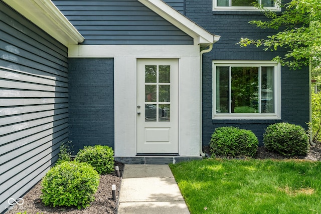 entrance to property with brick siding