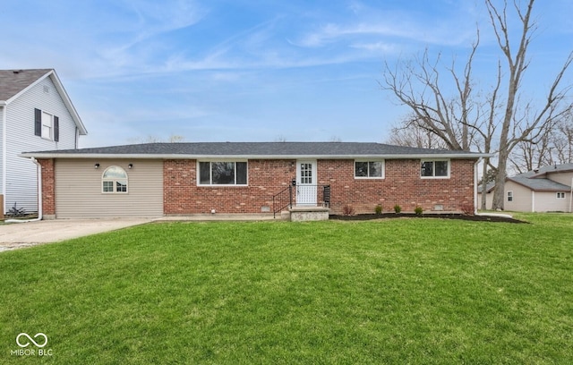 ranch-style home featuring brick siding and a front lawn