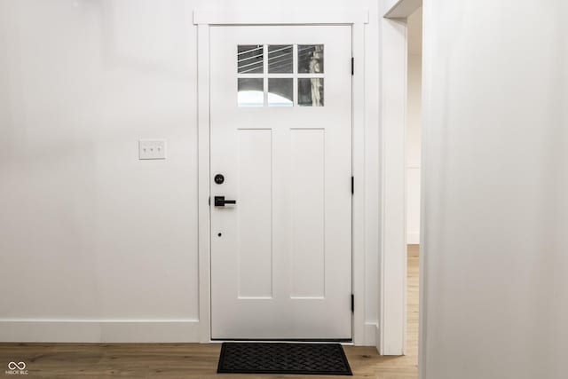 doorway to outside featuring light wood-type flooring