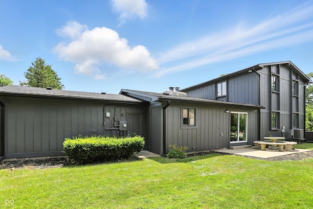 660 Sun Valley Ct, Indianapolis, IN 46217 - back of house featuring a patio and a lawn