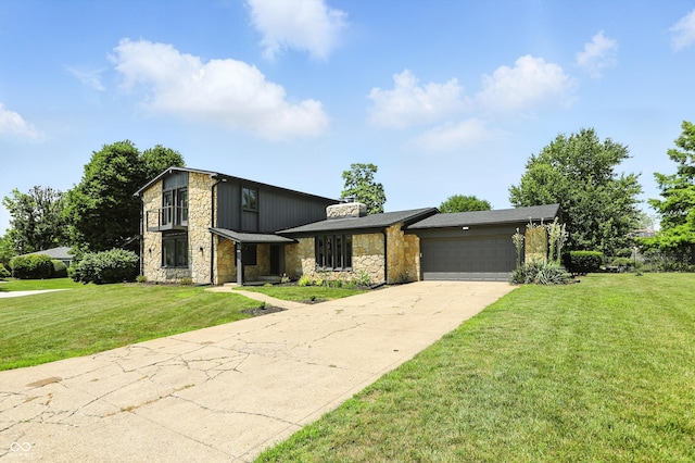 660 Sun Valley Ct, Indianapolis, IN 46217 - view of front facade with stone siding, an attached garage, concrete driveway, and a front yard