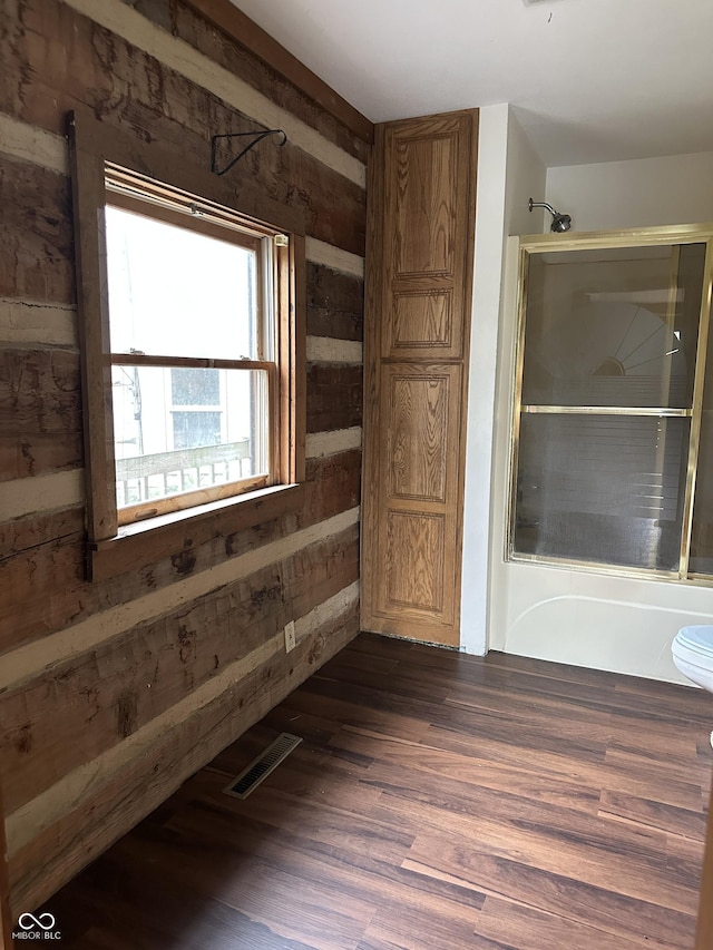 10770 W 650 S, Columbus, IN 47201 - unfurnished room featuring wooden walls, visible vents, and wood finished floors