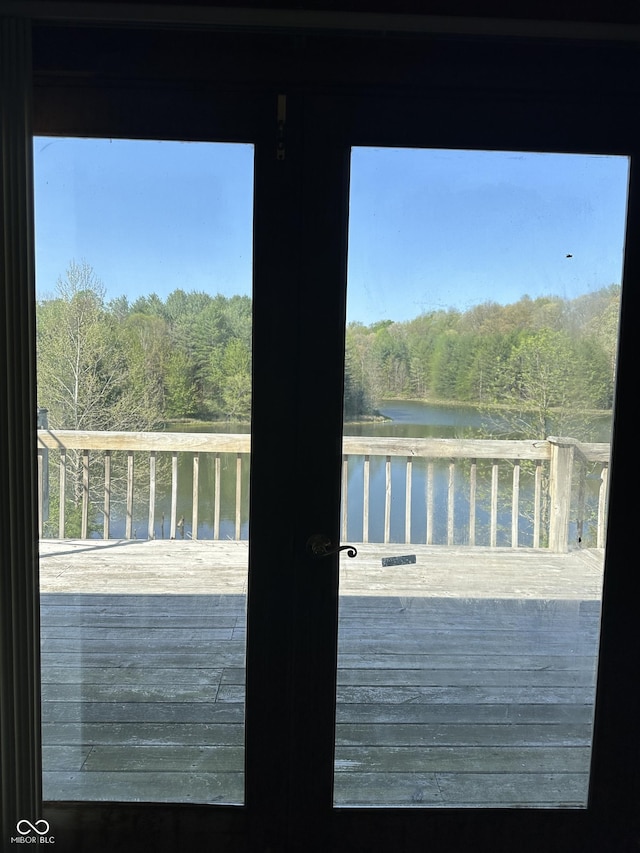 10770 W 650 S, Columbus, IN 47201 - doorway featuring a healthy amount of sunlight, a water view, and a view of trees