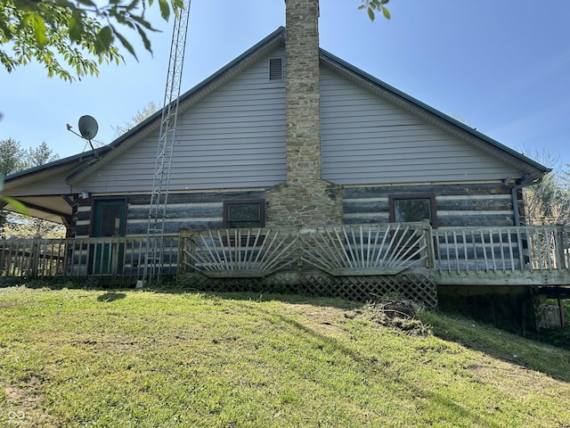 10770 W 650 S, Columbus, IN 47201 - rear view of house featuring a lawn, a chimney, and a deck