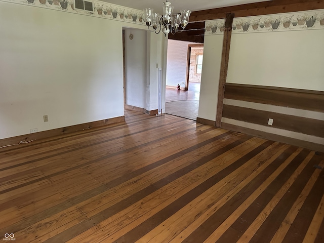 10770 W 650 S, Columbus, IN 47201 - unfurnished room featuring a chandelier, baseboards, visible vents, and dark wood finished floors