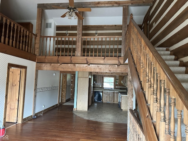 10770 W 650 S, Columbus, IN 47201 - unfurnished living room with stairway, ceiling fan, dark wood-style floors, and visible vents