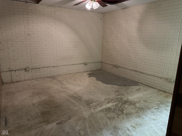 10770 W 650 S, Columbus, IN 47201 - spare room featuring concrete floors, ceiling fan, and brick wall