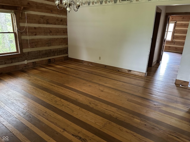 10770 W 650 S, Columbus, IN 47201 - unfurnished room featuring a notable chandelier and hardwood / wood-style floors