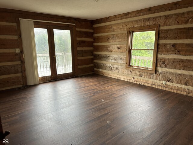 10770 W 650 S, Columbus, IN 47201 - empty room featuring french doors, wood walls, and dark wood-style flooring