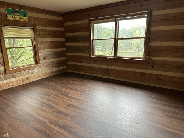 10770 W 650 S, Columbus, IN 47201 - unfurnished room with dark wood-type flooring and wooden walls