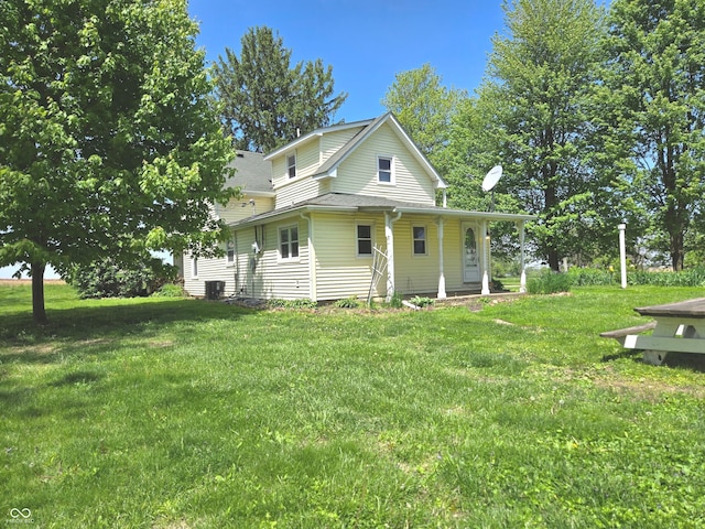 7561 N Hall School Rd, Monrovia, IN 46157 - view of front facade featuring covered porch, a front lawn, and roof with shingles