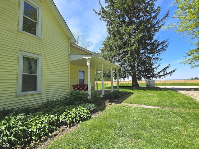 7561 N Hall School Rd, Monrovia, IN 46157 - view of green lawn with a porch