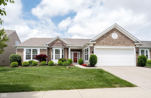 view of front of home featuring brick siding, an attached garage, concrete driveway, and a front lawn
