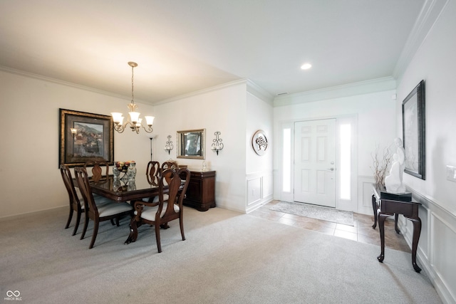 dining space featuring a chandelier, light colored carpet, ornamental molding, light tile patterned flooring, and recessed lighting