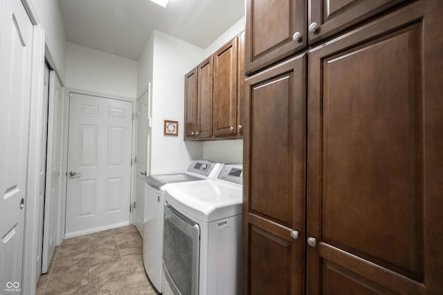 laundry area with cabinet space and washing machine and clothes dryer
