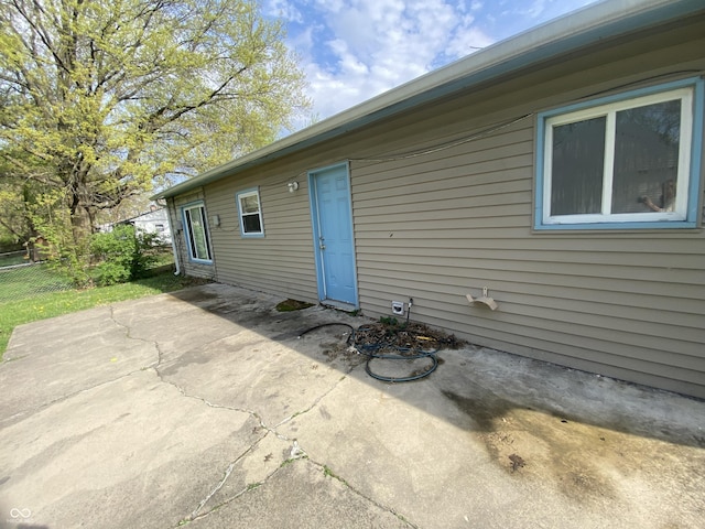 back of house featuring a patio and fence