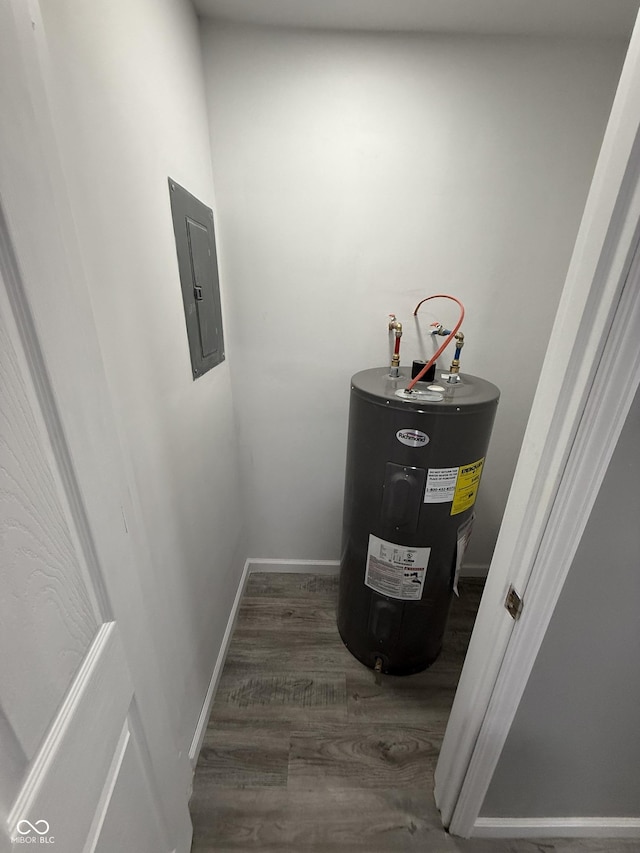 utility room featuring water heater and electric panel