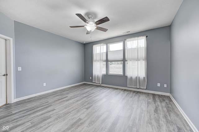 5110 Lilium Dr, Plainfield, IN 46168 - empty room with a ceiling fan and wood finished floors