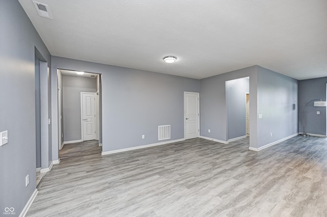5110 Lilium Dr, Plainfield, IN 46168 - spare room featuring light wood-style flooring and a textured ceiling