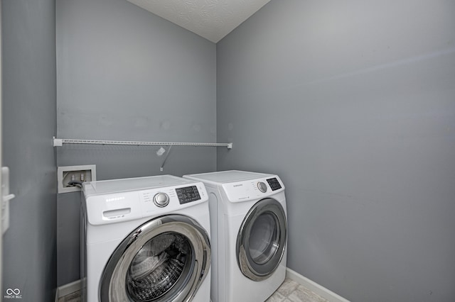 5110 Lilium Dr, Plainfield, IN 46168 - laundry room featuring separate washer and dryer and baseboards