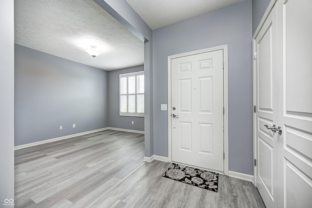 5110 Lilium Dr, Plainfield, IN 46168 - foyer entrance with wood finished floors and a textured ceiling