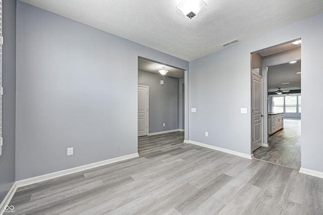 5110 Lilium Dr, Plainfield, IN 46168 - unfurnished room with wood finished floors, a textured ceiling, and a ceiling fan
