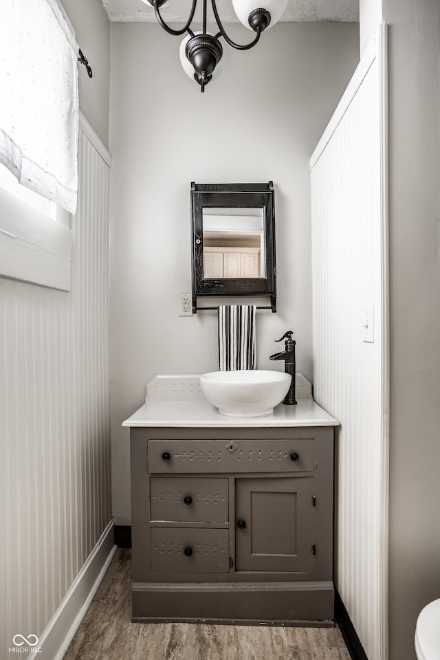 bathroom featuring vanity and baseboards