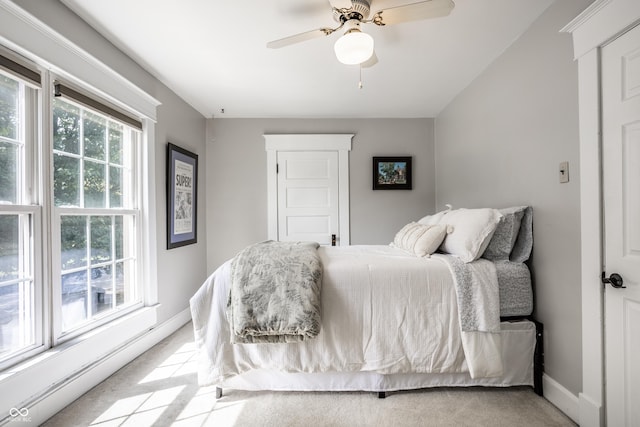 bedroom featuring carpet floors, baseboards, and ceiling fan