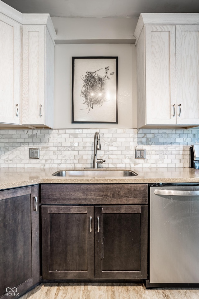 kitchen featuring a sink, light countertops, dark brown cabinetry, and dishwasher