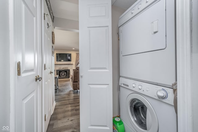 8140 Shorewalk Dr Unit C, Indianapolis, IN 46236 - clothes washing area featuring laundry area, stacked washing maching and dryer, and wood finished floors