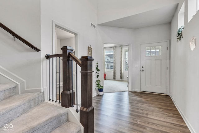 15120 Downham Dr, Fishers, IN 46037 - entrance foyer with stairway, baseboards, visible vents, and wood finished floors