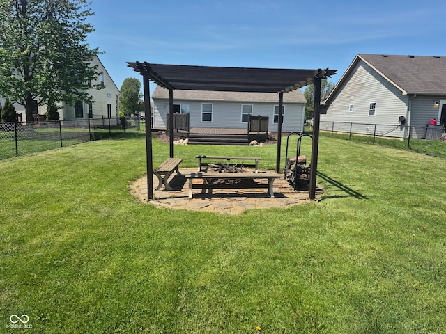 view of yard with fence, a pergola, and a wooden deck